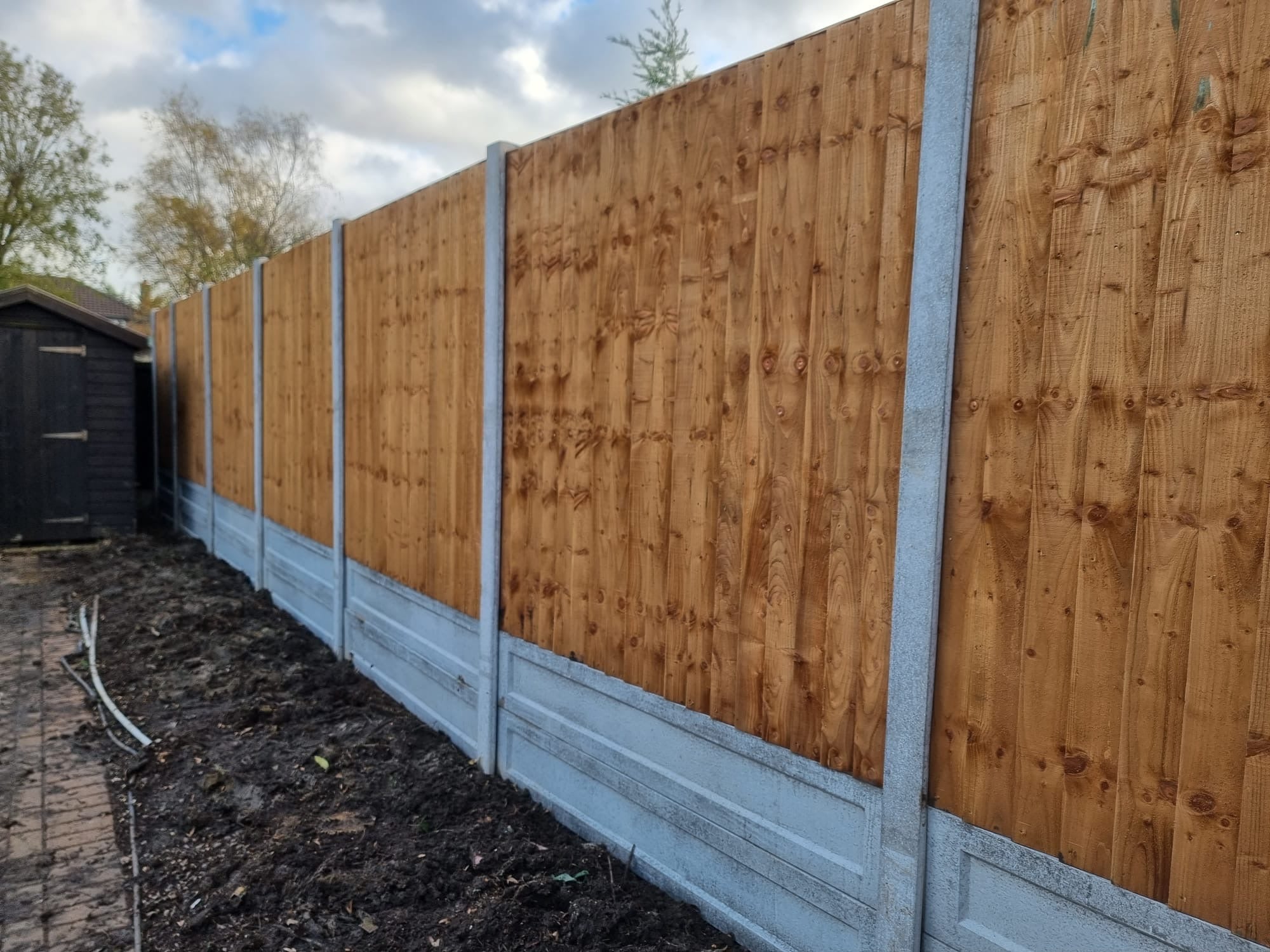 Professionally installed closeboard fencing with concrete posts and gravel boards by Romford Fencing Ltd