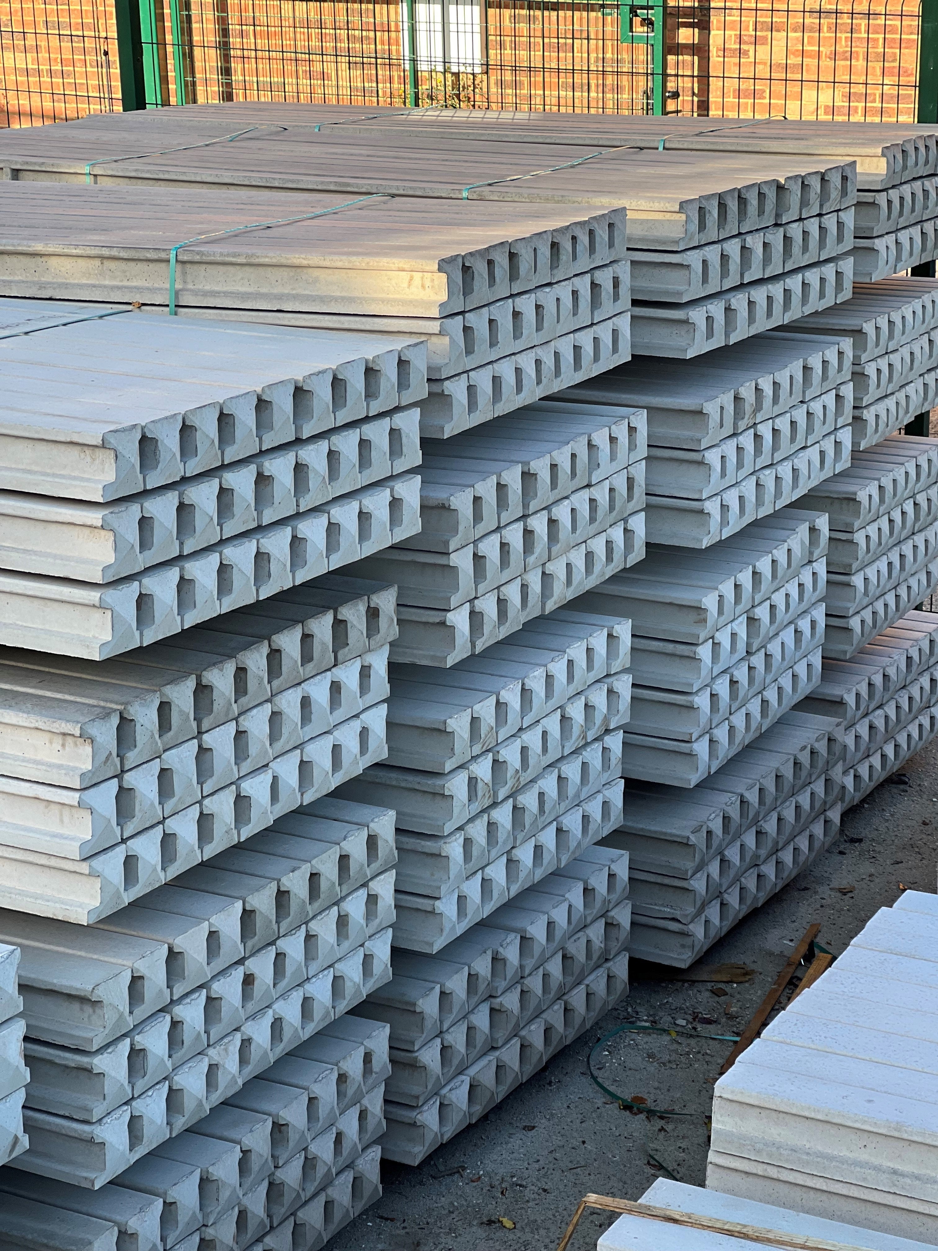 Pallets of concrete posts in Romford Fencing Ltd yard